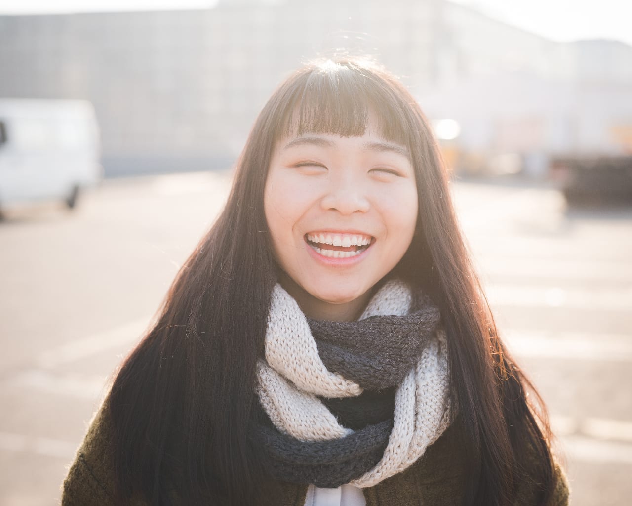 Happy lady after finishing her teeth whitening treatment