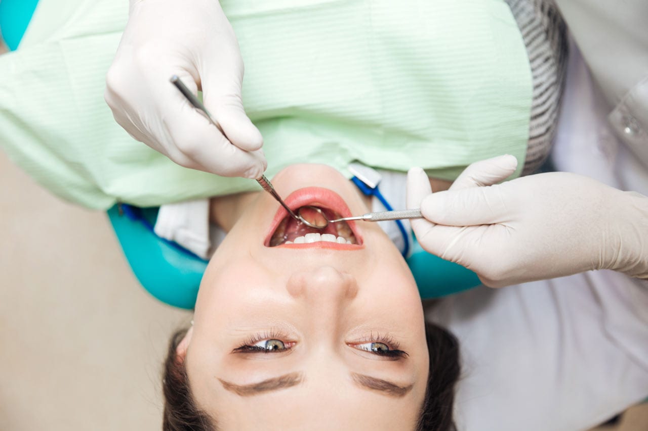 close up of lady getting her oral health checked by a dentist
