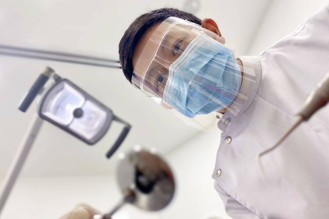 Dr-Joshua-Chong-performing-a-dental-procedure-patient-POV patient POV of dentist