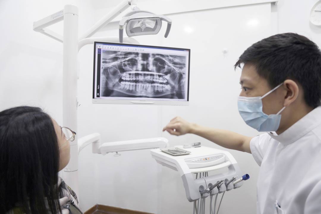 dental-xray-at-nofrillsdental-at-suntec-city-by-dr-joshua-chong dental xrays on a patient