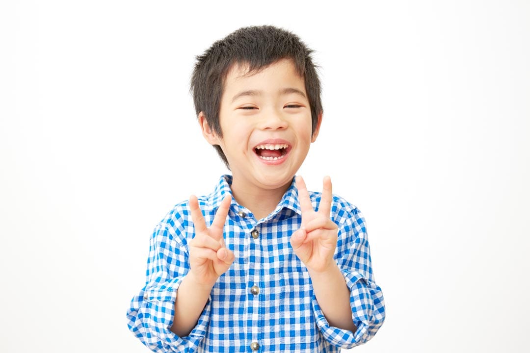 Happy little boy enjoying his Invisalign first treatment in Singapore