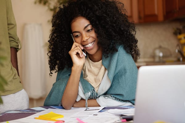 braces-female african lady wearing braces and studying