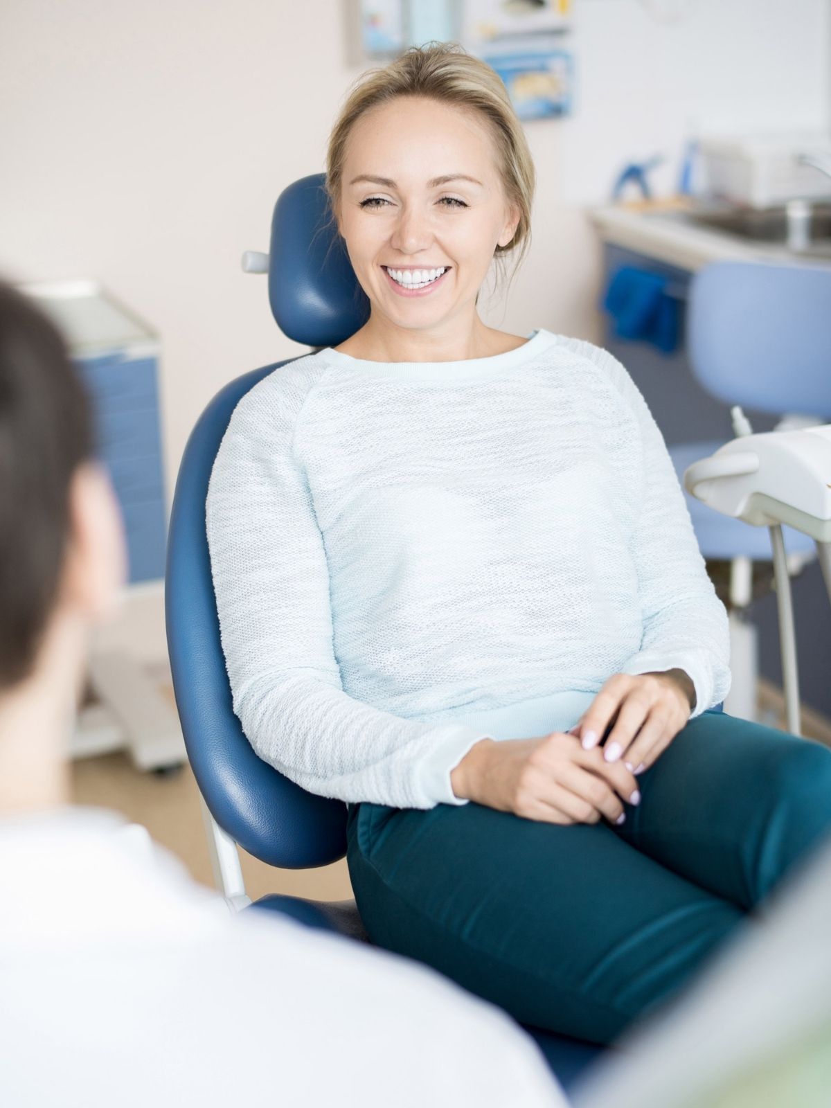 woman sitting on dentist chair woman sitting on dentist chair