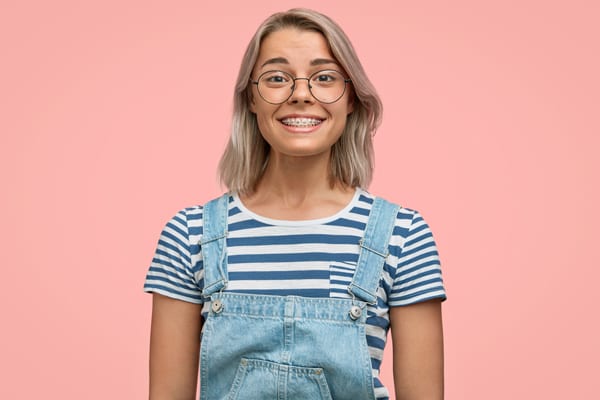 Lady wearing braces and smiling in Singapore